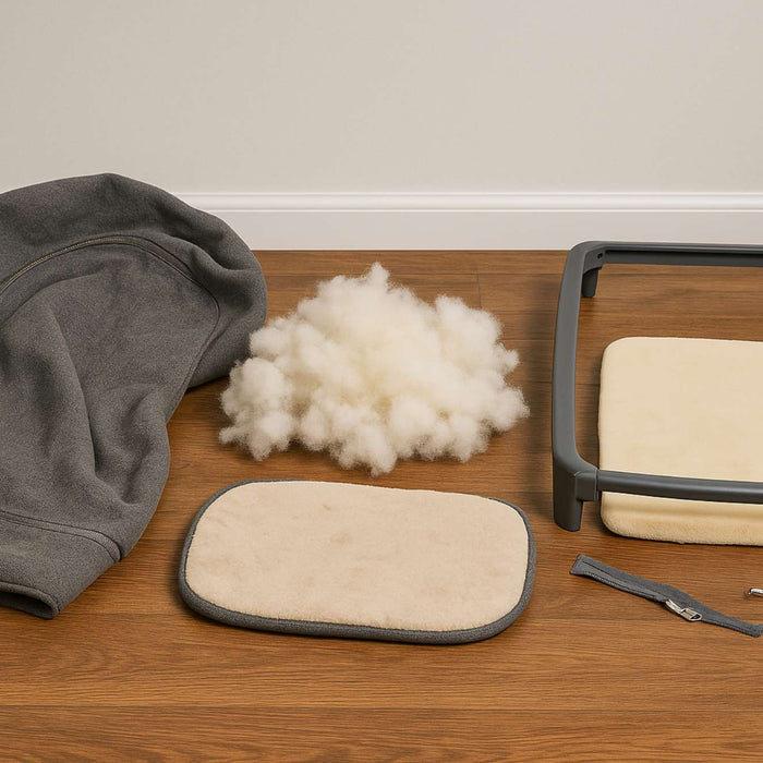 Dog bed taken apart into fabric, stuffing, foam, and a plastic frame to help explain are dog beds recyclable