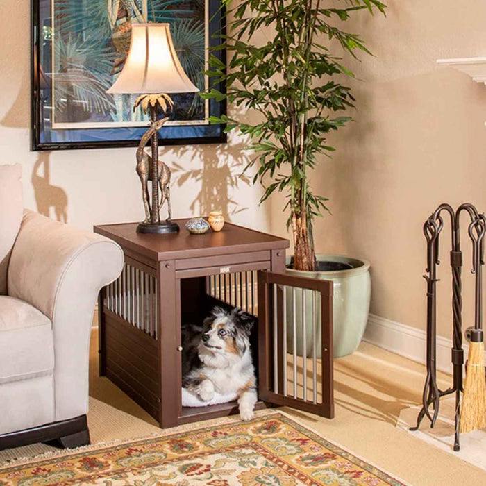 The wooden crate blends into the living room decor with a lamp and sculpture on top, showing one of the 6 Benefits of Using a Wooden Dog Crate