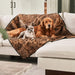 A French bulldog and a golden retriever are lounging together on the Paw PupProtector™ Short Fur Waterproof Throw Blanket - Sable Tan Dog Blanket For Couch