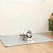 A Husky is lying on the floor covered with the Paw PupChill™ Cooling Waterproof Blanket - Arctic Grey Dog Mat