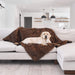 A Labrador Retriever is lying on a light grey sofa draped with a Paw PupProtector™ Waterproof Throw Blanket - Brown Dog Blanket