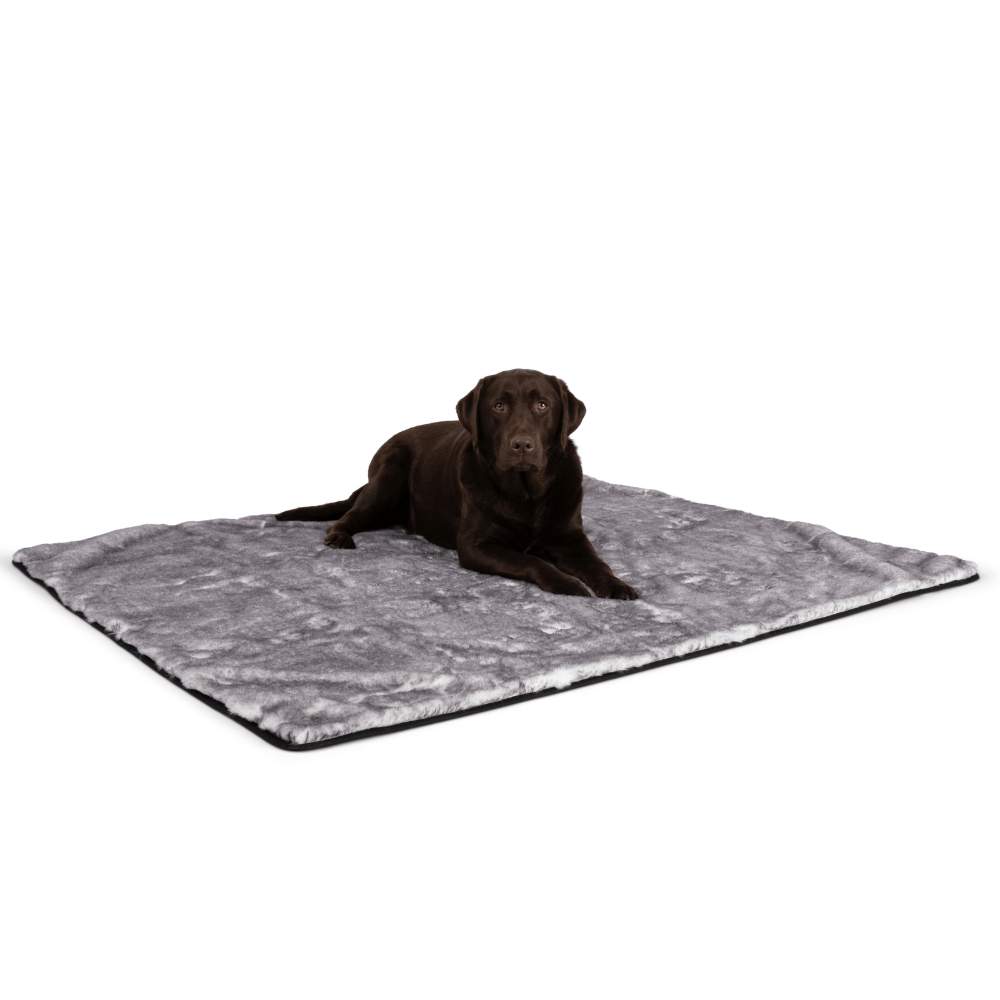 A Labrador is lying on the Paw PupProtector™ Waterproof Throw Blanket - Ultra Soft Chinchilla spread out on the floor