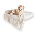 A Labrador is sitting happily on the Paw PupProtector™ Waterproof Couch Lounger - Polar White