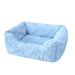 A baby blue, rectangular, plush dog bed with soft, furry fabric. The label reads Hello Doggie Bella Dog Bed
