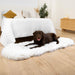 A brown and white dog comfortably lying on a Paw PupRug™ Runner Faux Fur Memory Foam Dog Bed Curve Polar White beside a bed with modern decor