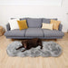 A chocolate labrador relaxing on a Paw PupRug™ Runner Faux Fur Memory Foam Dog Bed Charcoal Grey in front of a modern grey couch with decorative pillows