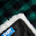 A close-up of the Paw PupProtector™ Waterproof Throw Blanket - Green Buffalo Plaid showing the label and soft texture