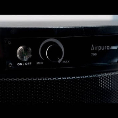 A close-up shot of the control panel on the Airpura G700 - Odor-Free Carbon for Chemically Sensitive (MCS) Air Purifier in black highlights the onoff switch and fan speed dial