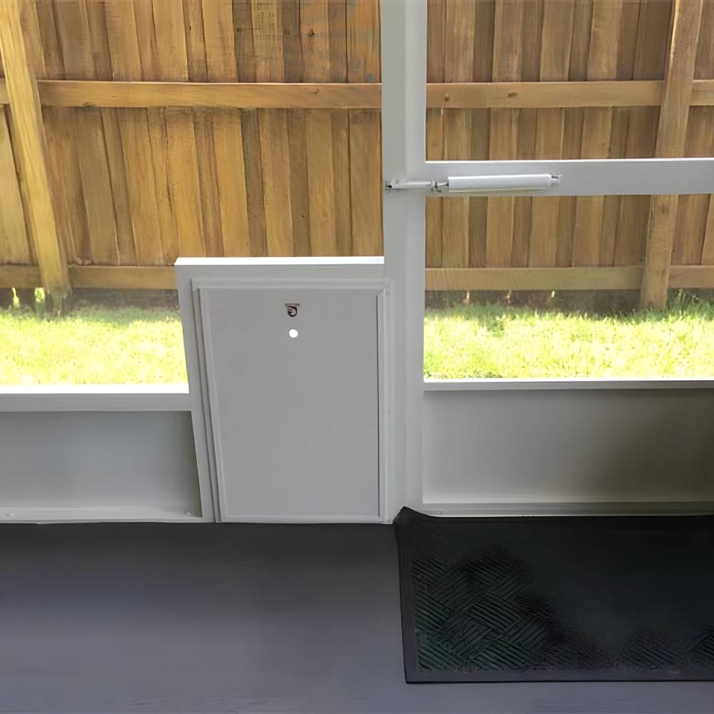 A close-up view of a white Security Boss SB4 Pet Screen Door installed in a screened enclosure, showing the door's lock mechanism and screen detail