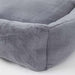 A detailed close-up of the Hello Doggie Big Baby Bed in alloy color highlights the soft, plush material and the precise stitching