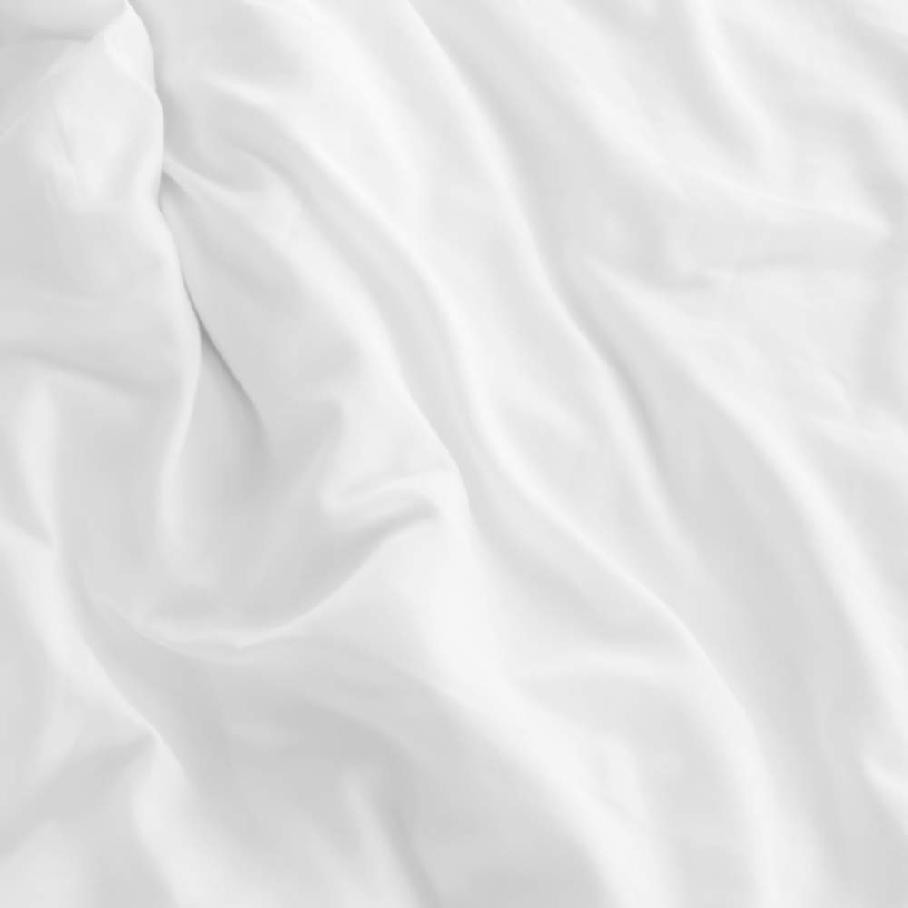 A detailed image highlighting the smooth texture of the Paw PupSheets™ Hair Resistant, Antimicrobial, & Cooling Duvet Cover and Sheet Set Bundle - White