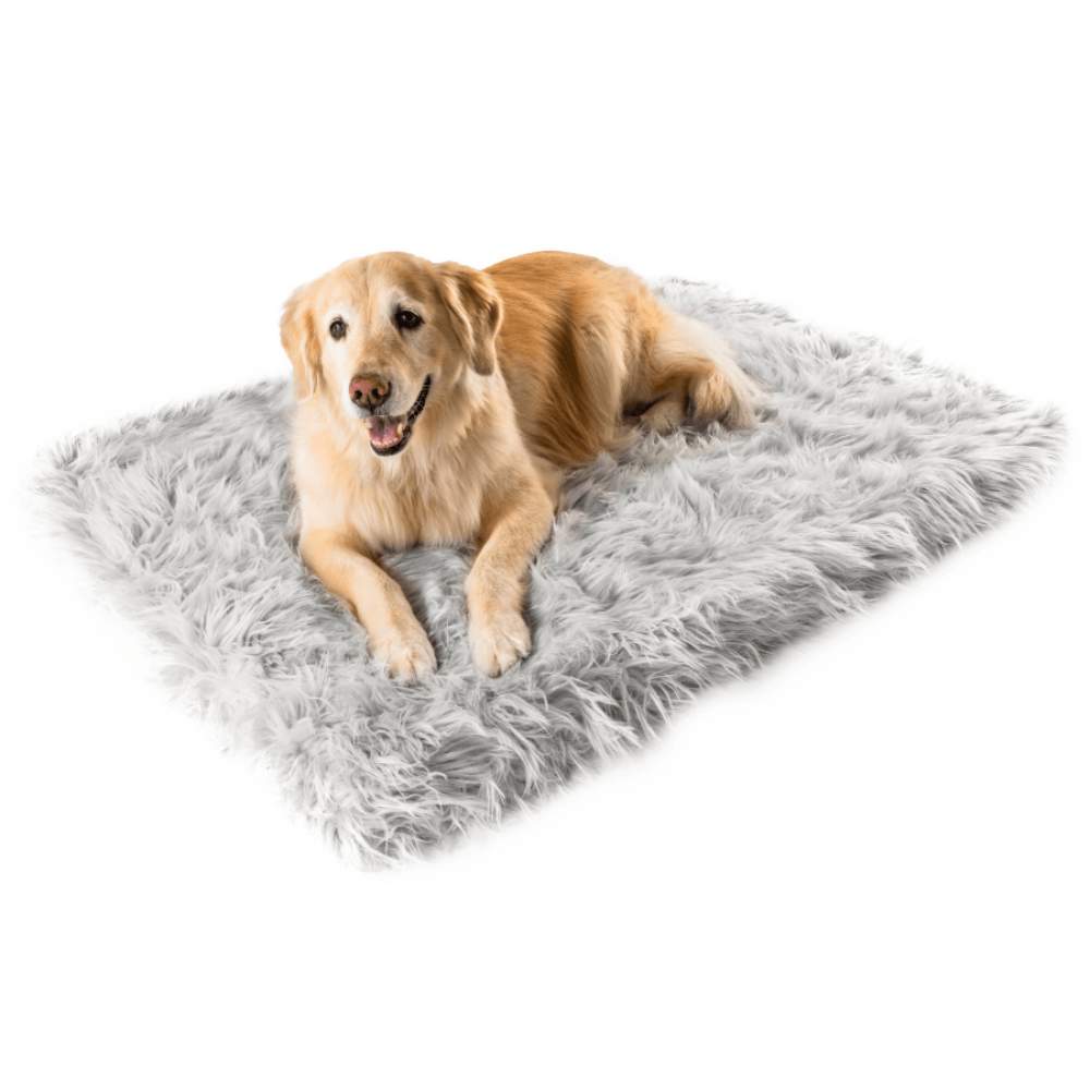 A golden retriever comfortably lying on a Rectangle Light Grey Paw PupRug Faux Fur Orthopedic Dog Bed