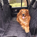 A golden retriever is comfortably sitting on the Paw PupProtector™ Back Seat Dog Car Cover, illustrating its function in providing a safe and clean space for pets