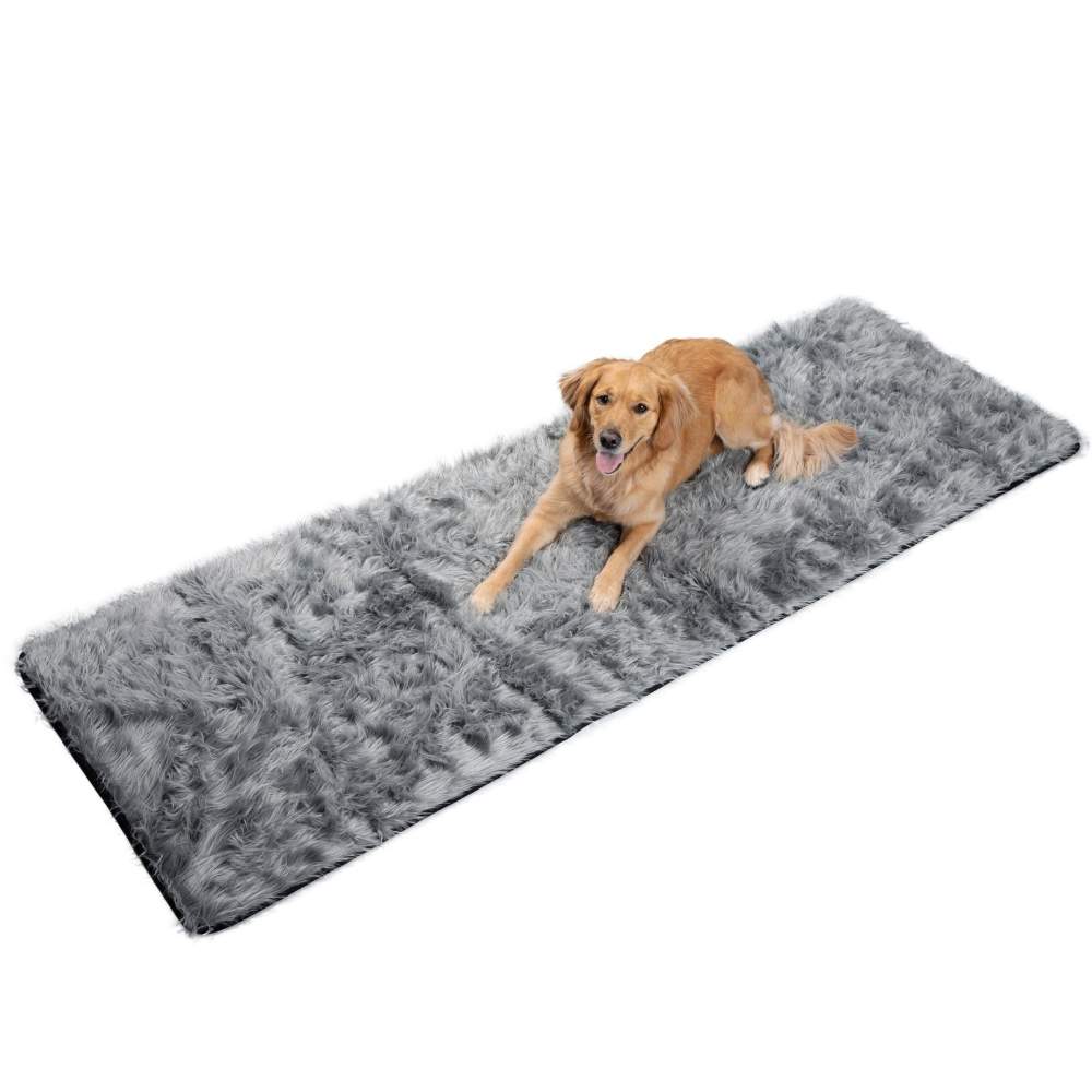 A golden retriever is lying on the floor on top of the Paw PupProtector™ Waterproof Bed Runner - Charcoal Grey