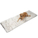 A golden retriever is lying on the floor on top of the Paw PupProtector™ Waterproof Bed Runner - White with Brown Accents