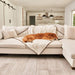 A golden retriever is sleeping on a couch covered with the Paw PupProtector™ Short Fur Waterproof Throw Blanket - Polar White in a modern living room