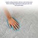 A hand is pressing on the Paw PupChill™ Cooling Waterproof Blanket to demonstrate its cooling effect