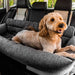 A large brown dog is laying relaxed in the back seat of a car on a Paw PupProtector™ Memory Foam Dog Car Bed