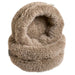 Alpaca Bowsers The Muffy Dog Bed is shown in soft brown faux fur with a hooded, cave-like design that gives pets a cozy enclosed space