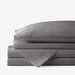 A neatly folded set of dark grey bedding, highlighting the Paw PupSheets™ Hair Resistant, Antimicrobial, & Cooling Duvet Cover and Sheet Set Bundle - Graphite