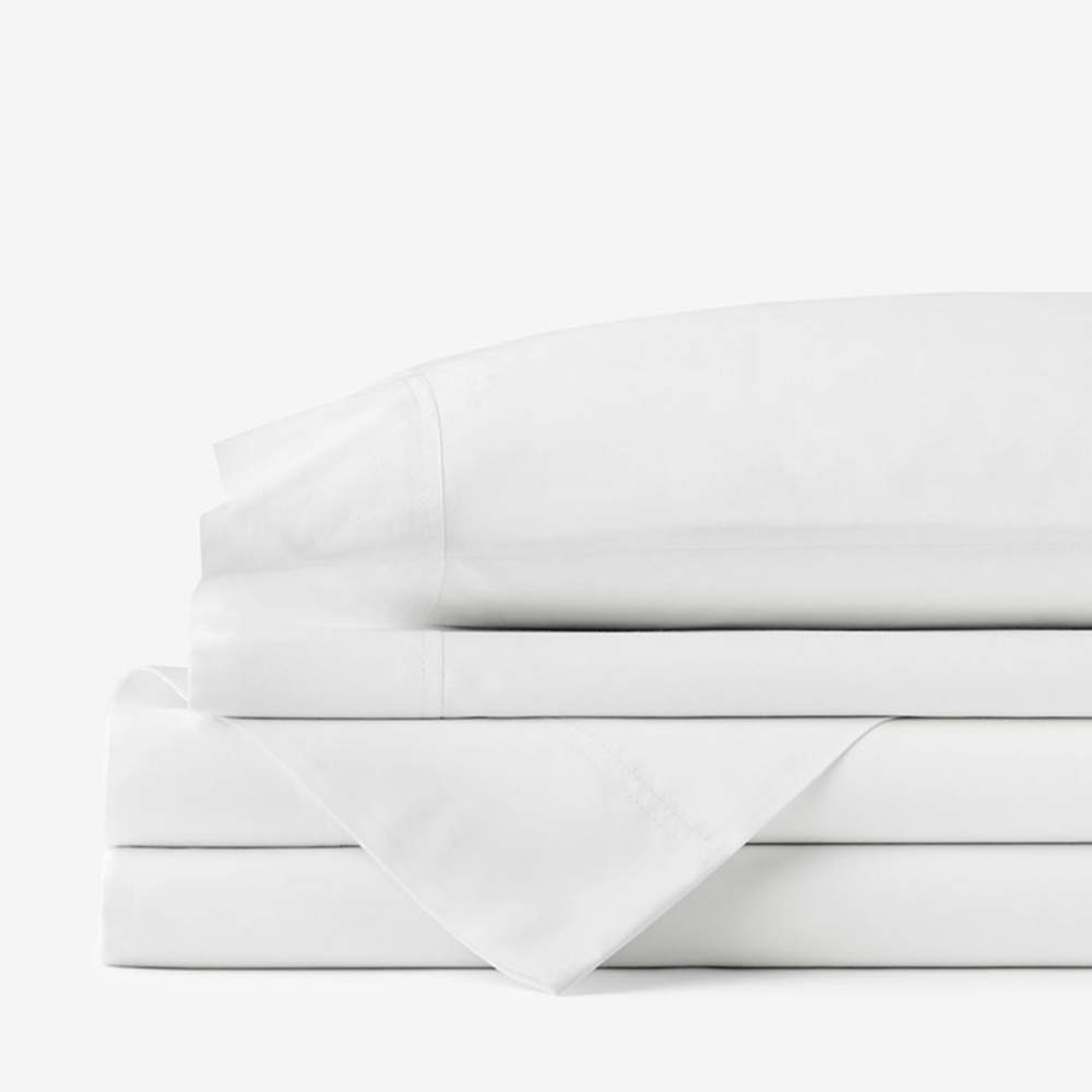 A neatly folded set of white sheets, representing the Paw PupSheets™ Hair Resistant, Antimicrobial, & Cooling Duvet Cover and Sheet Set Bundle - White