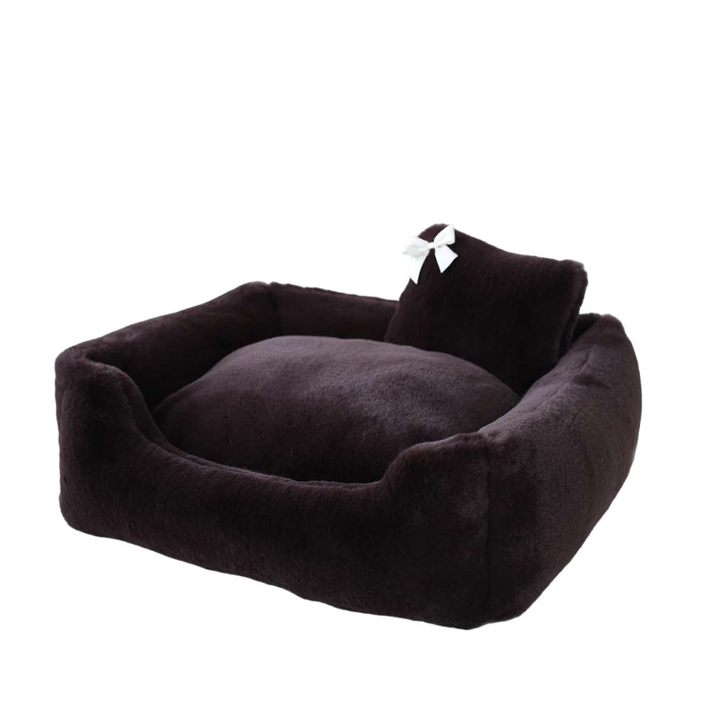An image displays the Hello Doggie Divine Dog Bed in espresso, highlighting its rich, dark color and stylish look with a white bow on the pillow