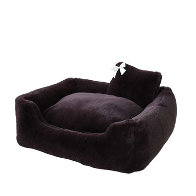 An image displays the Hello Doggie Divine Dog Bed in espresso, highlighting its rich, dark color and stylish look with a white bow on the pillow