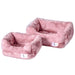 An image displays two Hello Doggie Cuddle Dog Bed units in mauve with a luxurious, velvety appearance and are designed with raised sides