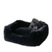 An image features the entire Hello Doggie Divine Dog Bed in black, showcasing its plush and elegant design, complete with a ruffled pillow