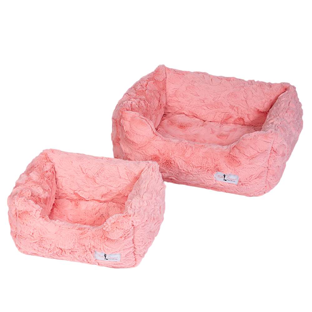 An image shows two Hello Doggie Cuddle Dog Bed units in peach with both beds are well-cushioned and have a soft, plush texture