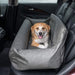 Another dog is comfortably lying in the Paw PupProtector™ Faux Leather Memory Foam Dog Car Bed - Slate Gray Doggy Bed, in the back seat of a car