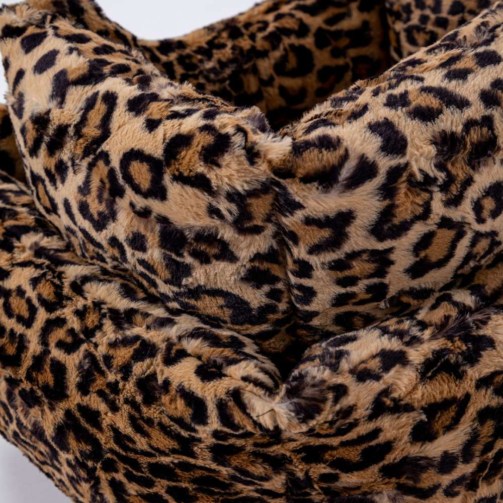 A plush, leopard-print Hello Doggie Cashmere Dog Bed, offering a stylish and comfortable resting place for pets with a bold pattern