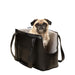 A pug sitting comfortably inside the Paw PupTote™ 3-in-1 Faux Leather Dog Carrier Bag - Black
