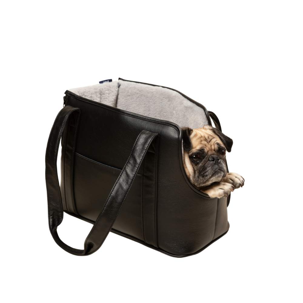 A pug with its head resting on the edge of the Paw PupTote™ 3-in-1 Faux Leather Dog Carrier Bag - Black