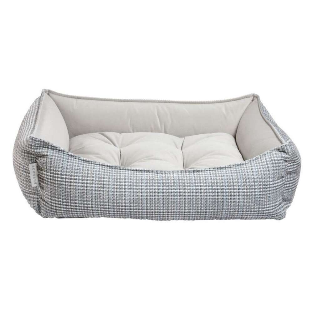 Arctica Bowsers One Of A Kind Scoop Dog Bed has a light gray woven exterior with a thick cushion, offering a clean and comfortable resting spot