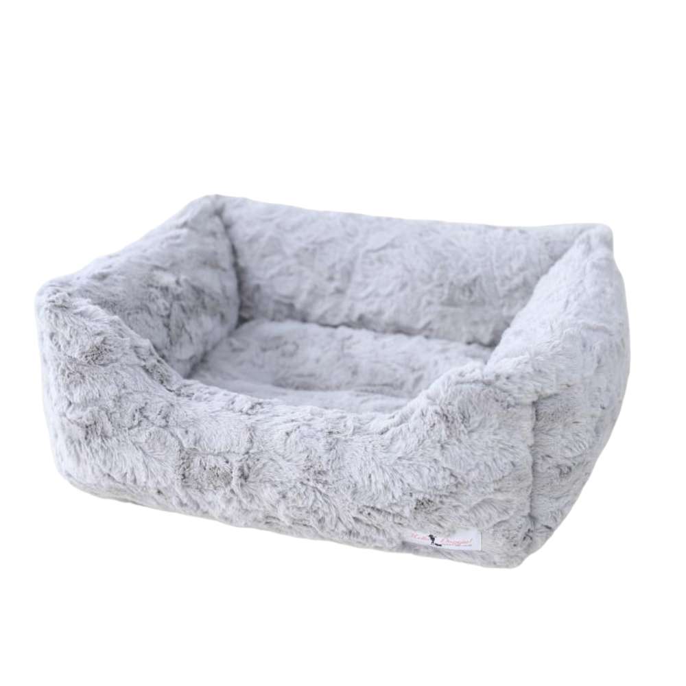 A silver, rectangular, plush dog bed with soft, furry fabric. The label reads Hello Doggie Bella Dog Bed