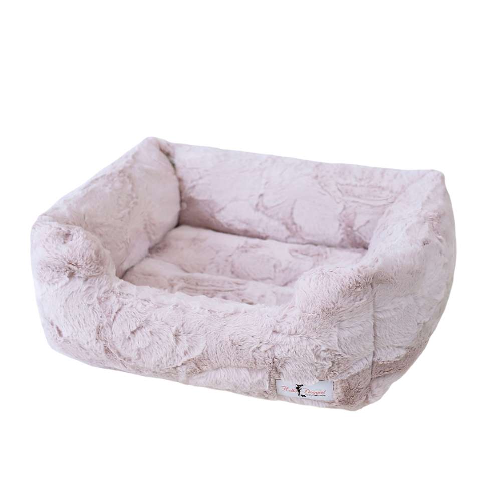 A single-layer dog bed in a blush pink hue from the Hello Doggie Luxe Dog Bed collection