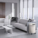 A sleek, modern living room with a white cylindrical air purifier placed beside a sofa, showcasing the Airpura P714 - Germs, Mold, and Chemicals Reduction Air Purifier