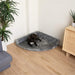 A small black dog with white markings is comfortably resting on the Charcoal Grey Paw PupRug™ Memory Foam Corner Dog Bed