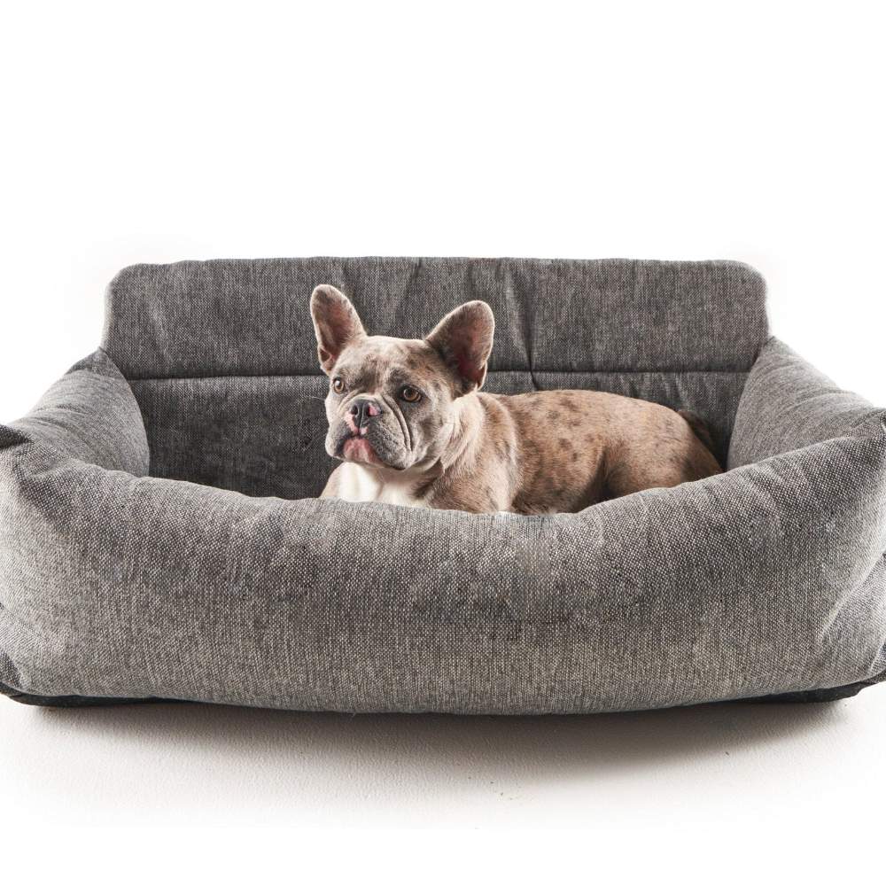 A small grey and white dog rests comfortably in a large Paw PupProtector™ Memory Foam Dog Car Bed - Double Seat