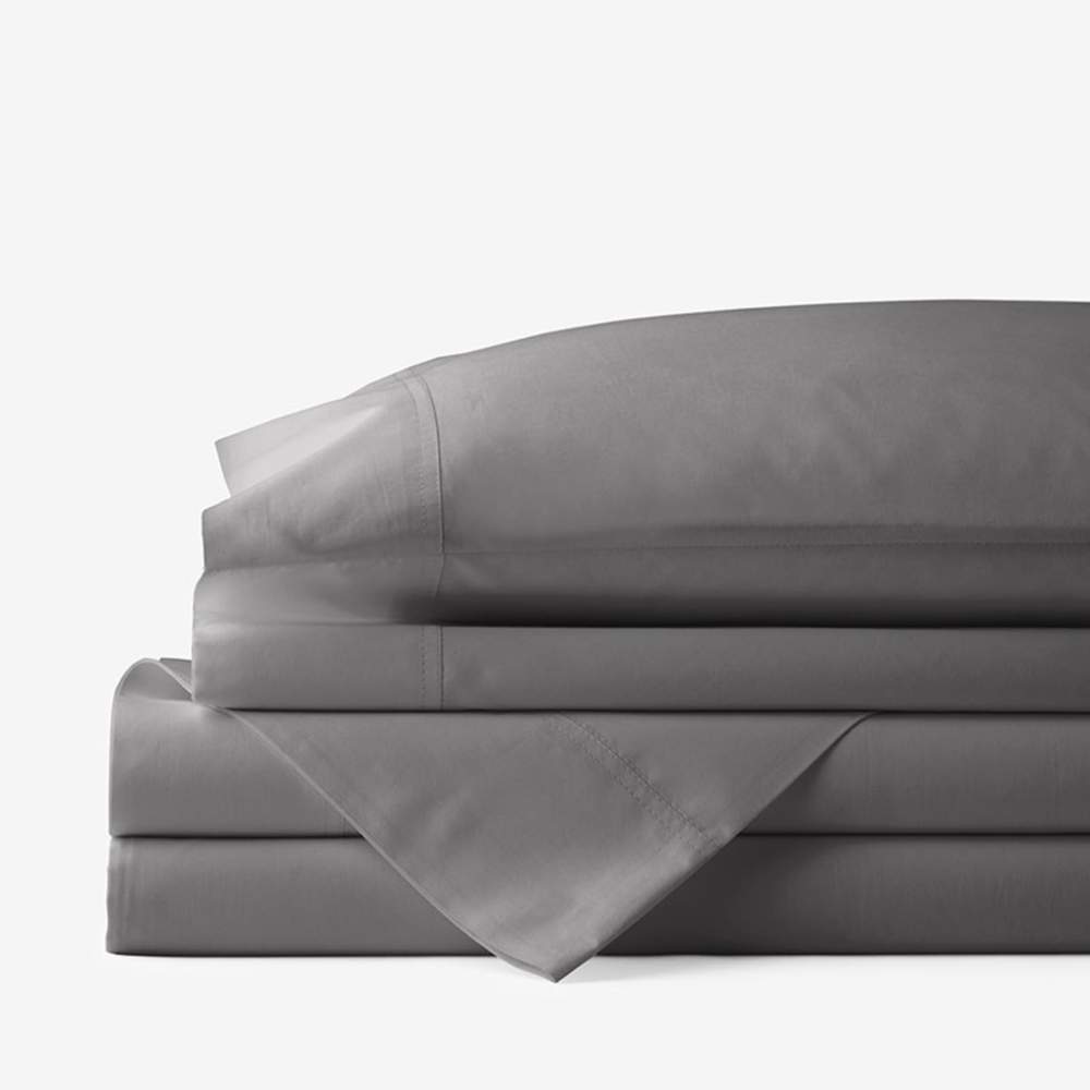 A stack of neatly folded gray bed sheets, emphasizing the Paw PupSheets™ Hair Resistant, Antimicrobial, & Cooling Bed Sheet Set - Graphite