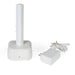 A white charging station stands next to an AC power adapter with a long, coiled white cable. This equipment is the PetSafe Passport Dog Door Rechargeable Battery and Charging Station