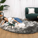A woman and her white dog playfully interact on a Charcoal Grey Paw PupCloud™ Human-Size Faux Fur Memory Foam Dog Bed