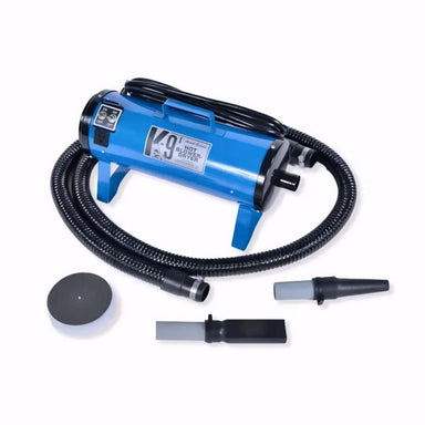 Blue K-9 I Dog Dryer with a long black hose and grooming nozzles is shown neatly arranged on a white surface