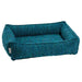 Blue Lagoon Bowsers Urban Lounger Dog Bed in bright teal textured fabric with supportive bolstered sides