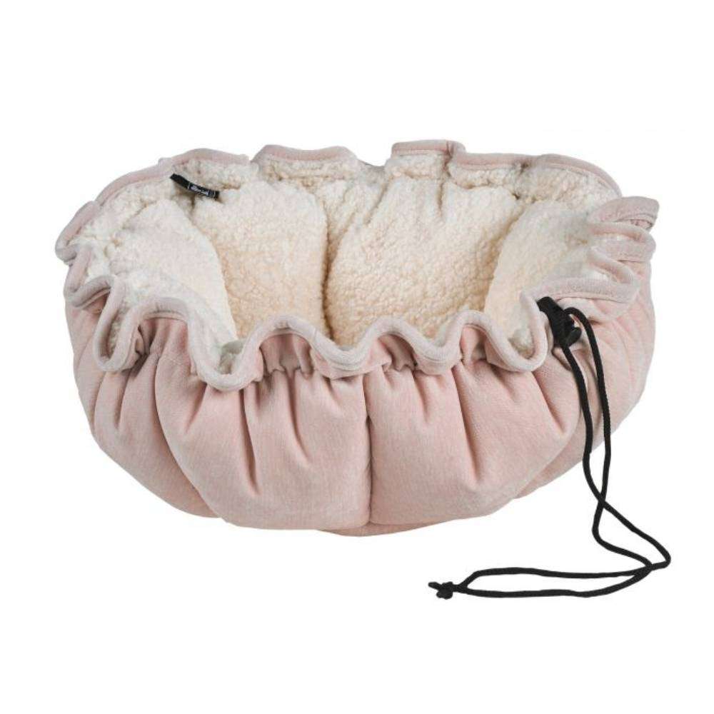 Blush Bowsers Buttercup Dog Bed in soft pink with a fluffy cream sherpa interior and adjustable drawstring edges