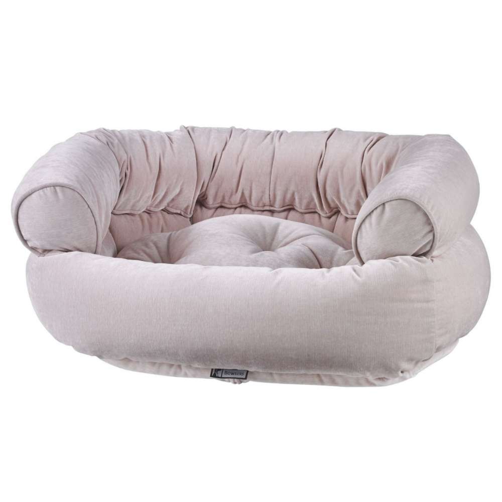 Blush Bowsers Double Donut Bed in blush pink velvet with a plush center cushion and wraparound bolsters