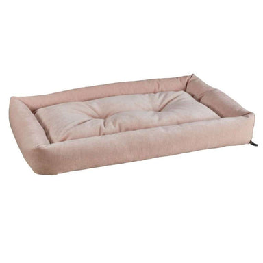 Blush Bowsers Tango Multi Dog Bed in blush pink has a soft tufted sleeping surface with padded bolsters