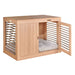 Bowsers Dream Futon Dog Bed sits inside a stylish wooden dog crate cabinet with soft cushions visible through the open door