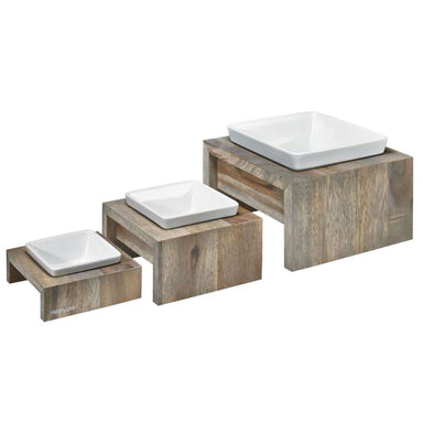 Bowsers Fossil Artisan Wood Feeder Single collection is shown in three sizes with rustic wood stands and white ceramic dishes